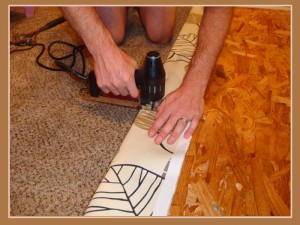 staple fabric to board Staple the fabric to the board